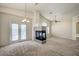 Bright living room with a fireplace, neutral paint, high ceilings, and a ceiling fan at 8768 Tom Noon Ave # 101, Las Vegas, NV 89178