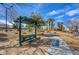 Community picnic area with covered seating, landscaping, and walking paths in a well-maintained common area at 8768 Tom Noon Ave # 101, Las Vegas, NV 89178