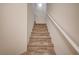 Carpeted staircase leading to the upper levels, providing a smooth transition between floors at 8768 Tom Noon Ave # 101, Las Vegas, NV 89178