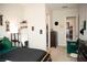 Inviting bedroom with black and green furniture, modern decor, and ample space, leading to closet and bathroom at 879 Klamath Springs St, Henderson, NV 89011
