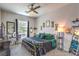Stylized bedroom with decorative accents and a modern ceiling fan for a comfortable living space at 879 Klamath Springs St, Henderson, NV 89011