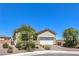 Well-kept single-story home with stone accents and a two-car garage at 879 Klamath Springs St, Henderson, NV 89011