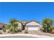 Charming single-story home with well-maintained landscaping and a two-car garage at 879 Klamath Springs St, Henderson, NV 89011