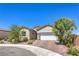 Charming single-story home with a well-manicured yard and a spacious two-car garage at 879 Klamath Springs St, Henderson, NV 89011