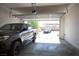 Spacious garage featuring ample parking and an open door with natural light coming through at 879 Klamath Springs St, Henderson, NV 89011