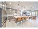 Modern, spacious kitchen with stainless steel appliances and a large kitchen island with barstool seating at 879 Klamath Springs St, Henderson, NV 89011