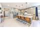 Bright kitchen featuring a large island with seating, stainless appliances, and ample cabinet space at 879 Klamath Springs St, Henderson, NV 89011