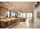 Open-concept kitchen with a large island, pendant lighting, and modern appliances at 879 Klamath Springs St, Henderson, NV 89011