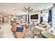 Open-concept living room with plenty of natural light flowing from kitchen to living room at 879 Klamath Springs St, Henderson, NV 89011