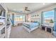 Bright and spacious main bedroom with large windows, ceiling fan and custom storage at 879 Klamath Springs St, Henderson, NV 89011