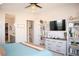 Stylish main bedroom with a television, neutral decor, and easy access to the ensuite bathroom and closet at 879 Klamath Springs St, Henderson, NV 89011