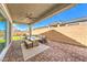 Covered patio featuring a comfortable seating area and outdoor ceiling fan at 879 Klamath Springs St, Henderson, NV 89011