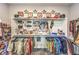 Spacious walk-in closet with custom shelving and ample space for clothing and accessories at 879 Klamath Springs St, Henderson, NV 89011