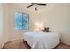 Comfortable bedroom with a ceiling fan and neutral walls at 9050 Warm Springs Rd # 2050, Las Vegas, NV 89148