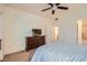 Comfortable bedroom features a dresser with tv and neutral walls at 9050 Warm Springs Rd # 2050, Las Vegas, NV 89148