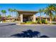 Attractive community clubhouse surrounded by lush landscaping and well-kept greenery at 9050 Warm Springs Rd # 2050, Las Vegas, NV 89148
