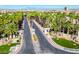 Community entrance with well-maintained landscaping and grand entryway at 9050 Warm Springs Rd # 2050, Las Vegas, NV 89148