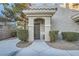 Charming front entrance with manicured bushes and a covered entryway at 9050 Warm Springs Rd # 2050, Las Vegas, NV 89148