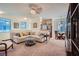 Open-concept living space with plenty of natural light, comfortable sofa, and a dining area at 9050 Warm Springs Rd # 2050, Las Vegas, NV 89148