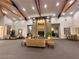 Elegant lobby area with high ceilings, comfortable seating, a fireplace, and stylish decor at 9050 Warm Springs Rd # 2050, Las Vegas, NV 89148