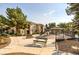Outdoor play area with picnic tables and a gazebo, surrounded by lush landscaping and walkways at 9050 Warm Springs Rd # 2050, Las Vegas, NV 89148