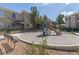 Community playground area for children with slide and bench seating in a well maintained outdoor space at 9050 Warm Springs Rd # 2050, Las Vegas, NV 89148