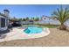 Relaxing backyard features a pool, spa and putting green, ideal for enjoying leisure time outdoors at 9100 Shelter Cove Ct, Las Vegas, NV 89117