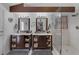 Bathroom with double vanities, walk-in shower, and updated fixtures at 9100 Shelter Cove Ct, Las Vegas, NV 89117