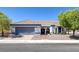 Charming single-story home featuring desert landscaping, a two-car garage, and a welcoming entrance at 9100 Shelter Cove Ct, Las Vegas, NV 89117
