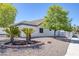 A charming house with well-maintained desert landscaping, featuring palm trees and gravel groundcover at 9100 Shelter Cove Ct, Las Vegas, NV 89117