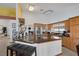 Charming kitchen with granite island, stainless steel appliances, and wood cabinetry at 9100 Shelter Cove Ct, Las Vegas, NV 89117