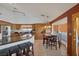 Bright kitchen features stainless steel appliances, granite countertops, and breakfast bar at 9100 Shelter Cove Ct, Las Vegas, NV 89117