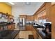 Modern kitchen features stainless steel appliances, granite countertops, and wooden cabinets at 9100 Shelter Cove Ct, Las Vegas, NV 89117