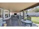 Inviting covered patio with comfortable seating and a putting green, great for entertaining at 9100 Shelter Cove Ct, Las Vegas, NV 89117