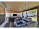 Inviting covered patio with comfortable seating and a putting green, perfect for outdoor relaxation at 9100 Shelter Cove Ct, Las Vegas, NV 89117