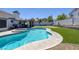 A pristine backyard pool and putting green offer relaxation and entertainment in this desert oasis at 9100 Shelter Cove Ct, Las Vegas, NV 89117