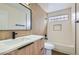 Bathroom features a white vanity with black fixtures and a tile backsplash at 916 Pro Players Dr, Las Vegas, NV 89134