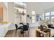 Bright dining room with high ceilings and large windows at 916 Pro Players Dr, Las Vegas, NV 89134