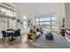 Spacious open concept living area with dining space, high ceilings, and plenty of natural light at 916 Pro Players Dr, Las Vegas, NV 89134