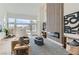 Bright living room featuring contemporary fireplace, modern decor, and view of backyard at 916 Pro Players Dr, Las Vegas, NV 89134