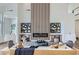 Modern living room with statement fireplace, high ceilings, and contemporary decor at 916 Pro Players Dr, Las Vegas, NV 89134