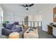 Loft area with cozy seating, a ceiling fan and railing overlooking downstairs at 916 Pro Players Dr, Las Vegas, NV 89134