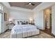 Inviting main bedroom featuring a decorative accent ceiling, large windows, and plush bed at 916 Pro Players Dr, Las Vegas, NV 89134