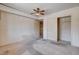 Bedroom featuring a ceiling fan, closet, and wall-to-wall carpeting at 9337 Quail Ridge Dr, Las Vegas, NV 89134