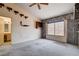 Bedroom featuring a ceiling fan, window, and wall-to-wall carpeting at 9337 Quail Ridge Dr, Las Vegas, NV 89134