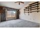 Bedroom featuring a ceiling fan, window, and wall-to-wall carpeting at 9337 Quail Ridge Dr, Las Vegas, NV 89134