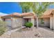 A charming entrance to a single-story home with a tile roof and desert rock landscaping at 9337 Quail Ridge Dr, Las Vegas, NV 89134