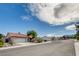 Single-story house featuring desert landscaping, tile roofing, and an attached two-car garage at 9337 Quail Ridge Dr, Las Vegas, NV 89134