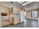 Kitchen with neutral cabinets, tile floors, and a view of the living room at 9337 Quail Ridge Dr, Las Vegas, NV 89134