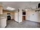 Bright kitchen with tile flooring, plentiful cabinetry, and black appliances at 9337 Quail Ridge Dr, Las Vegas, NV 89134